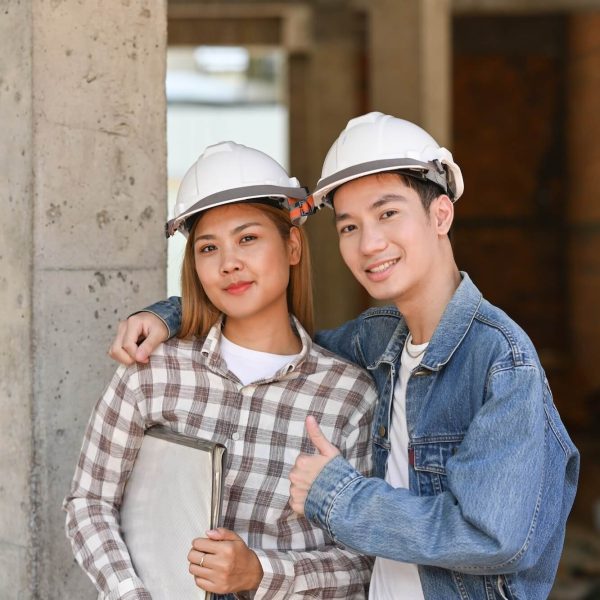 two-happy-investors-in-helmet-standing-at-construction-site-real-estate-investors-concept-1-1.jpg